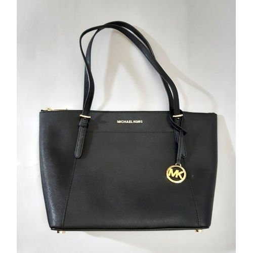 430 - Michael Kors  top zip Tote bag in black leather; interior has zipped compartment and 2 open pockets.... 