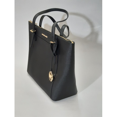 430 - Michael Kors  top zip Tote bag in black leather; interior has zipped compartment and 2 open pockets.... 