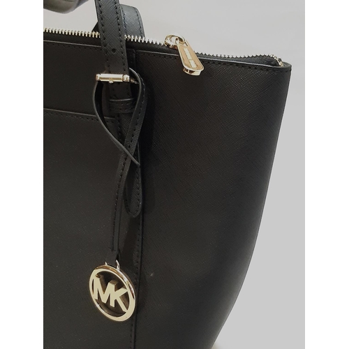 430 - Michael Kors  top zip Tote bag in black leather; interior has zipped compartment and 2 open pockets.... 