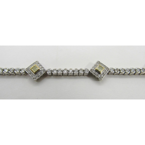 1367 - A demi-parure of 18ct white gold, white and yellow diamond jewellery, comprising bracelet and pair o... 