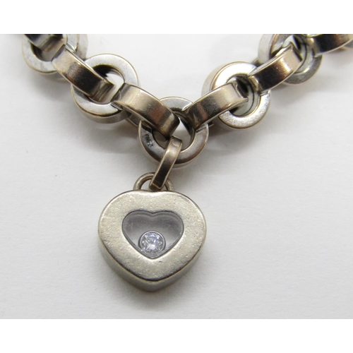 1368 - Chopard. an 18ct white gold ‘Happy Diamonds’ bracelet, with single diamond in a love heart shaped su... 