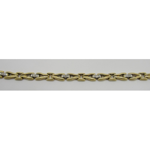 1370 - An 18ct yellow gold link bracelet, the links interspersed with six diamond couplings, 20cm long, sta... 