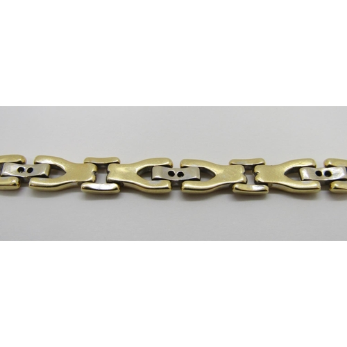 1370 - An 18ct yellow gold link bracelet, the links interspersed with six diamond couplings, 20cm long, sta... 