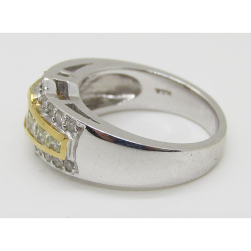 1371 - An 18ct white gold, fancy yellow and white diamond dress ring, with yellow gold mount enclosing seve... 