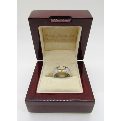 1372 - An 18ct white gold ring, set with a single bezel set marquise diamond, marked 750, 6.4g. 

Sold with... 