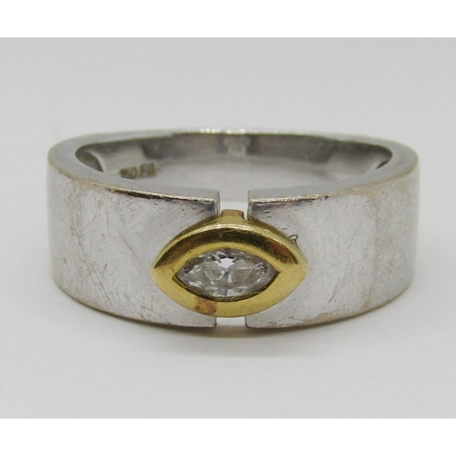 1372 - An 18ct white gold ring, set with a single bezel set marquise diamond, marked 750, 6.4g. 

Sold with... 