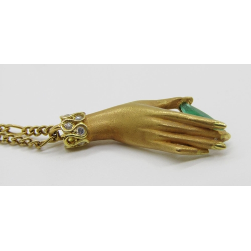 1373 - Carrera y Carrera, Madrid. A Spanish gold pendant necklace, in the form of a hand holding a single c... 