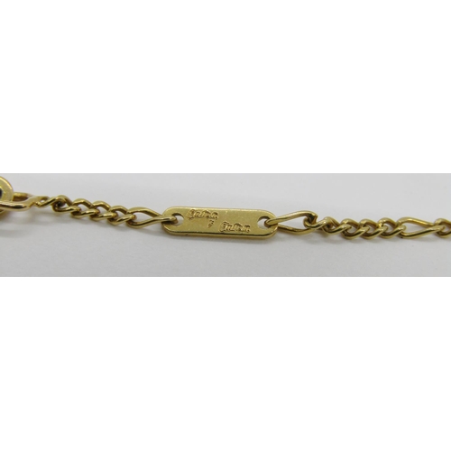 1373 - Carrera y Carrera, Madrid. A Spanish gold pendant necklace, in the form of a hand holding a single c... 