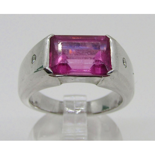 1374 - Boodles & Dunthorne. An 18ct white gold dress ring, centred with a 4.09ct emerald-cut pink rubellite... 