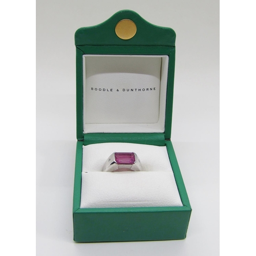 1374 - Boodles & Dunthorne. An 18ct white gold dress ring, centred with a 4.09ct emerald-cut pink rubellite... 