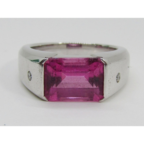 1374 - Boodles & Dunthorne. An 18ct white gold dress ring, centred with a 4.09ct emerald-cut pink rubellite... 