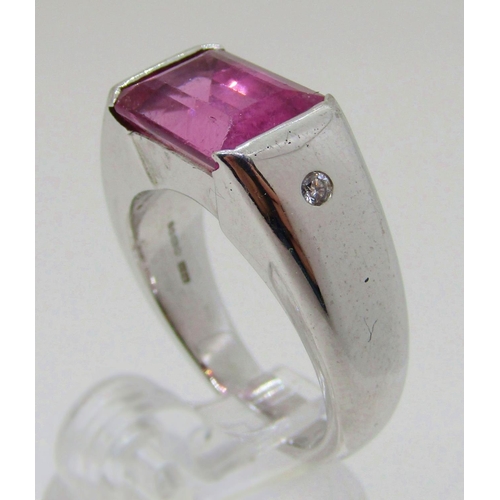 1374 - Boodles & Dunthorne. An 18ct white gold dress ring, centred with a 4.09ct emerald-cut pink rubellite... 