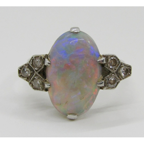 1377 - An antique platinum, opal and diamond dress ring, the central opal flanked with diamond-set shoulder... 