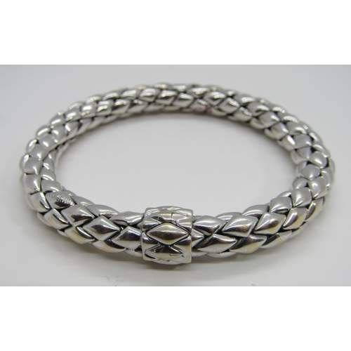 1379 - Chimento. An 18ct white gold ‘stretch’ bracelet, marked Chimento, 750, 21cm long, 34g (boxed).