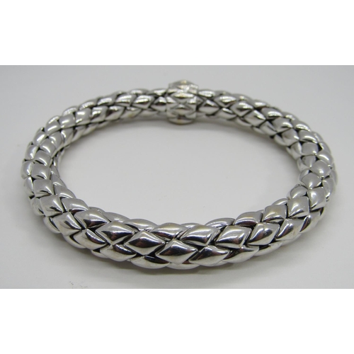 1379 - Chimento. An 18ct white gold ‘stretch’ bracelet, marked Chimento, 750, 21cm long, 34g (boxed).