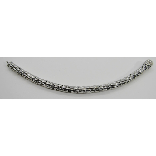 1379 - Chimento. An 18ct white gold ‘stretch’ bracelet, marked Chimento, 750, 21cm long, 34g (boxed).