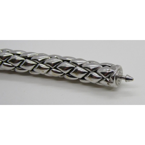 1379 - Chimento. An 18ct white gold ‘stretch’ bracelet, marked Chimento, 750, 21cm long, 34g (boxed).