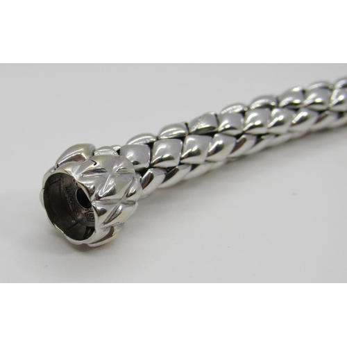 1379 - Chimento. An 18ct white gold ‘stretch’ bracelet, marked Chimento, 750, 21cm long, 34g (boxed).