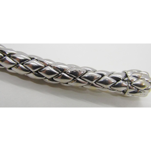 1379 - Chimento. An 18ct white gold ‘stretch’ bracelet, marked Chimento, 750, 21cm long, 34g (boxed).