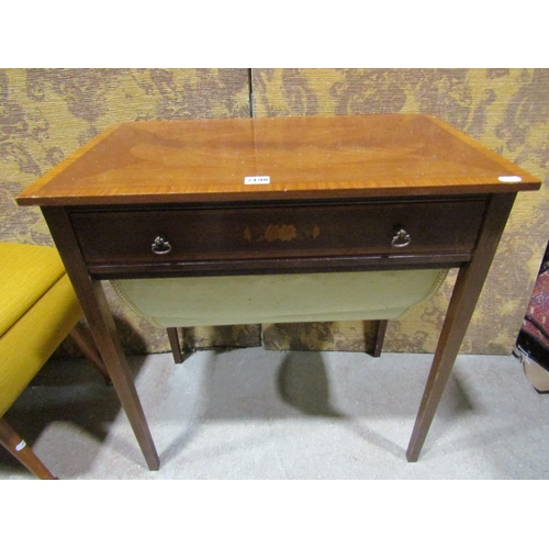 2198 - An inlaid Edwardian mahogany sewing table with cross banded detail and frieze drawer over a wool bag... 