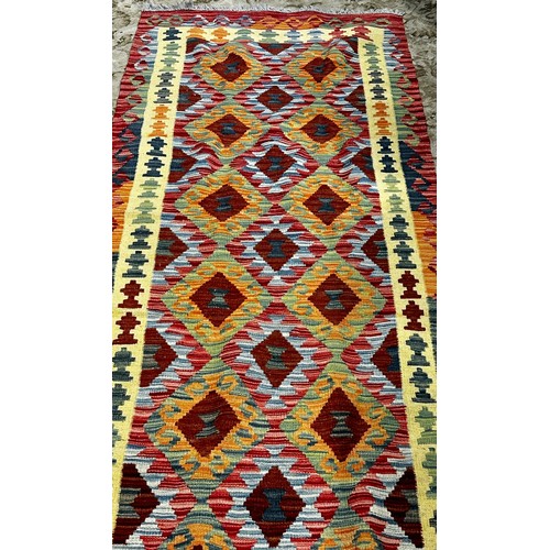 2712 - Chobi kilim runner, with a central panel of brightly coloured diamonds, 296cm x 80cm