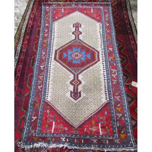 2710 - A Kamseh type rug with a central elongated medallion with a geometric border, 188cm 95cm.