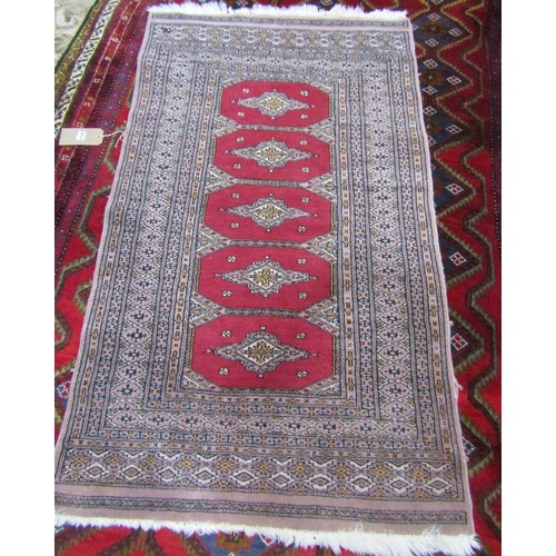 2711 - Two Middle Eastern type carpets with a panel of five divisions with a central medallion, 150cm x 90c... 