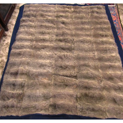 2729 - An opossum fur throw on a blue felt lining, 180cm x 160cm, together with a reversible two tone, brow... 