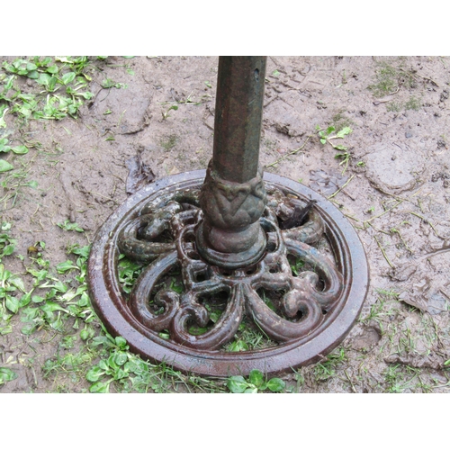 2060 - Weathered cast iron bird bath with circular pierced top, raised on a central pillar with pierced cir... 