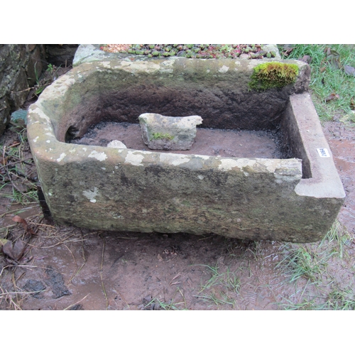 2064 - A weathered rectangular natural stone 'D' end trough (broken but complete) 68cm long x 44cm wide x 2... 