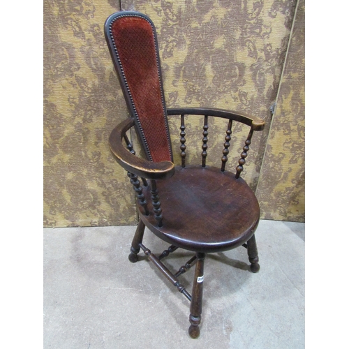 2196 - An Edwardian stained beechwood elbow chair with turned spindle back and solid dish seat