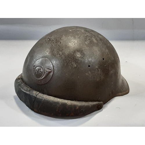 1769 - A French WWI period Trench Helmet, with applied ‘R F’ insignia.