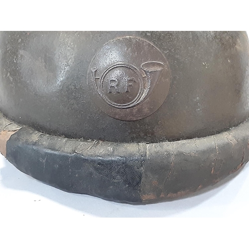 1769 - A French WWI period Trench Helmet, with applied ‘R F’ insignia.