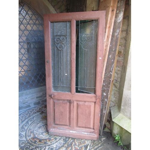 2076 - An old French wooden farmhouse door with glazed openings and iron work panels, 91cm wide x 200cm hig... 