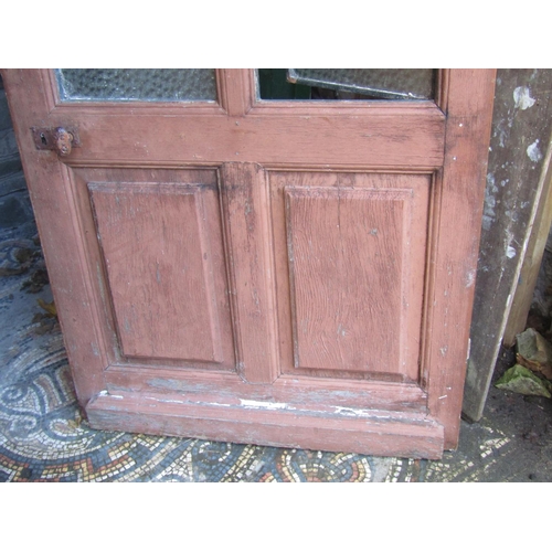 2076 - An old French wooden farmhouse door with glazed openings and iron work panels, 91cm wide x 200cm hig... 