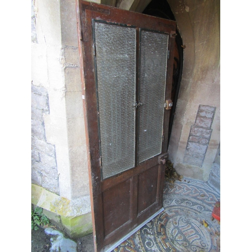 2076 - An old French wooden farmhouse door with glazed openings and iron work panels, 91cm wide x 200cm hig... 