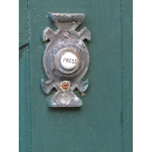 2077 - A 1930s painted front door with oval leaded light panel and irpn fittings, 84cm wide x 198cm high