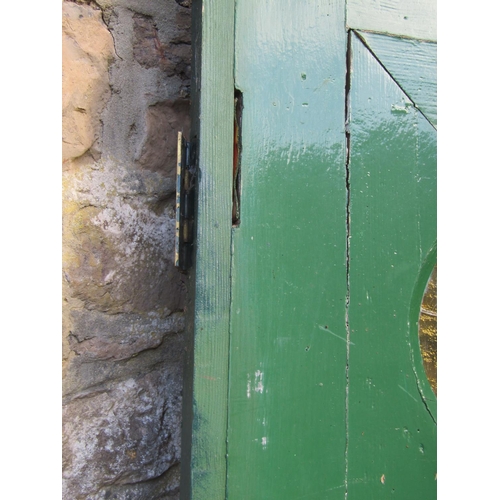 2077 - A 1930s painted front door with oval leaded light panel and irpn fittings, 84cm wide x 198cm high