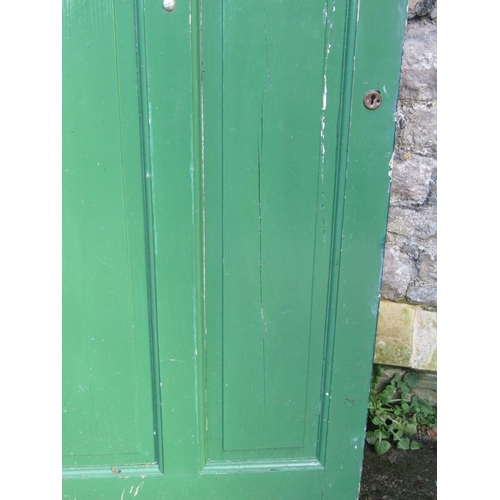 2077 - A 1930s painted front door with oval leaded light panel and irpn fittings, 84cm wide x 198cm high