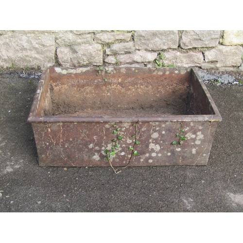 2081 - A weathered rectangular iron trough with flared rim, 62cm long x 42cm wide x 21cm high