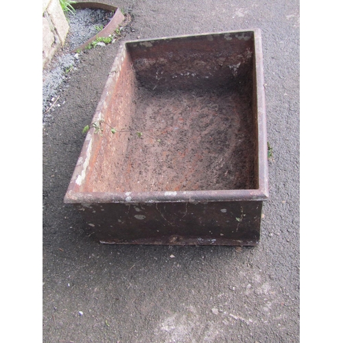 2081 - A weathered rectangular iron trough with flared rim, 62cm long x 42cm wide x 21cm high