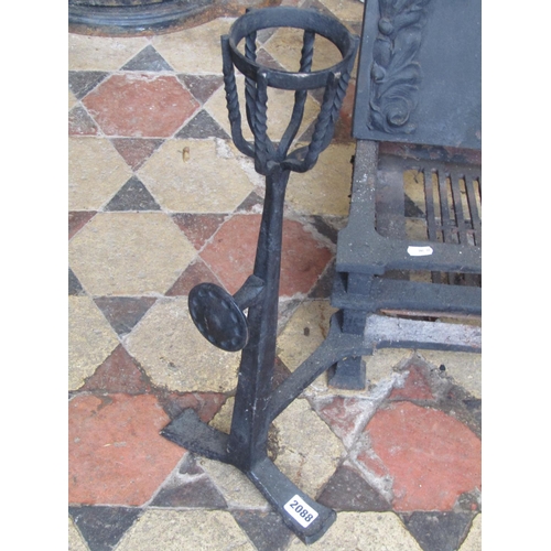 2088 - An Arts and crafts style cast iron fire basket and combined dogs the arched back plate with raised r... 