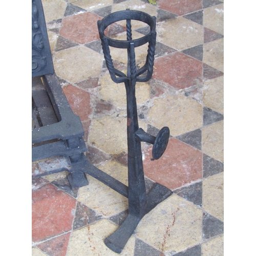 2088 - An Arts and crafts style cast iron fire basket and combined dogs the arched back plate with raised r... 