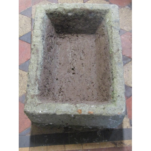 2113 - A weathered rectangular natural stone trough with canted interior, 54cm long x 39cm wide x 21cm deep