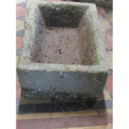 2113 - A weathered rectangular natural stone trough with canted interior, 54cm long x 39cm wide x 21cm deep