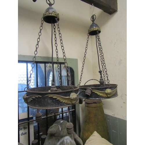 2120 - A run of four large iron work ceiling light fittings with gilt painted highlighted winged cherub det... 