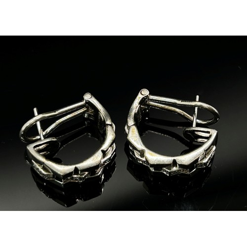 1381 - Chimento. A pair of 18ct white gold and diamond set earrings, each marked Chimento, 750 and *408 VI,... 