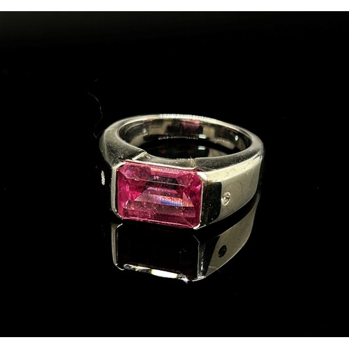 1374 - Boodles & Dunthorne. An 18ct white gold dress ring, centred with a 4.09ct emerald-cut pink rubellite... 