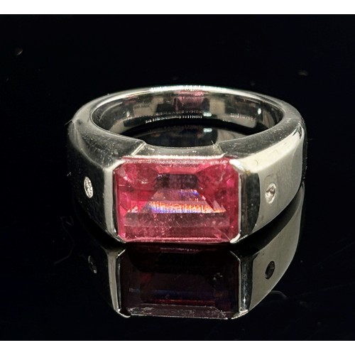 1374 - Boodles & Dunthorne. An 18ct white gold dress ring, centred with a 4.09ct emerald-cut pink rubellite... 