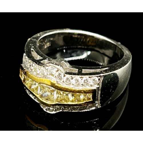 1371 - An 18ct white gold, fancy yellow and white diamond dress ring, with yellow gold mount enclosing seve... 